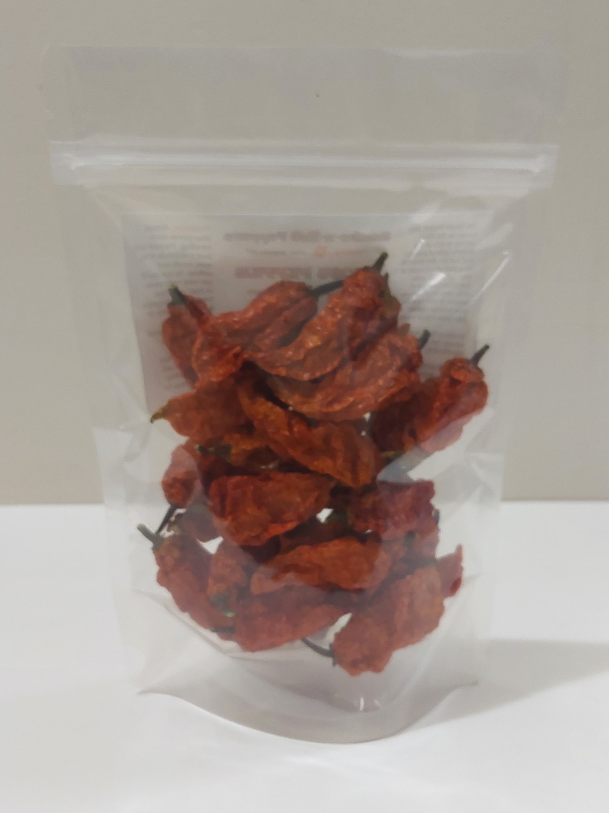 1 oz. DRIED WHOLE GHOST PEPPER (BHUT JOLOKIA) CHILI PODS..USA GROWN!
