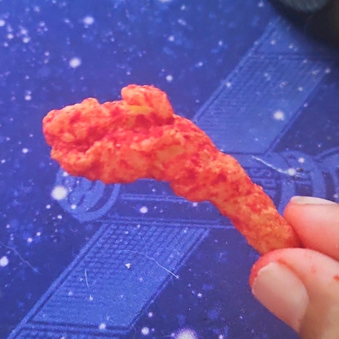 Single Cheese Puff Puffed Snack Piece – Red Color