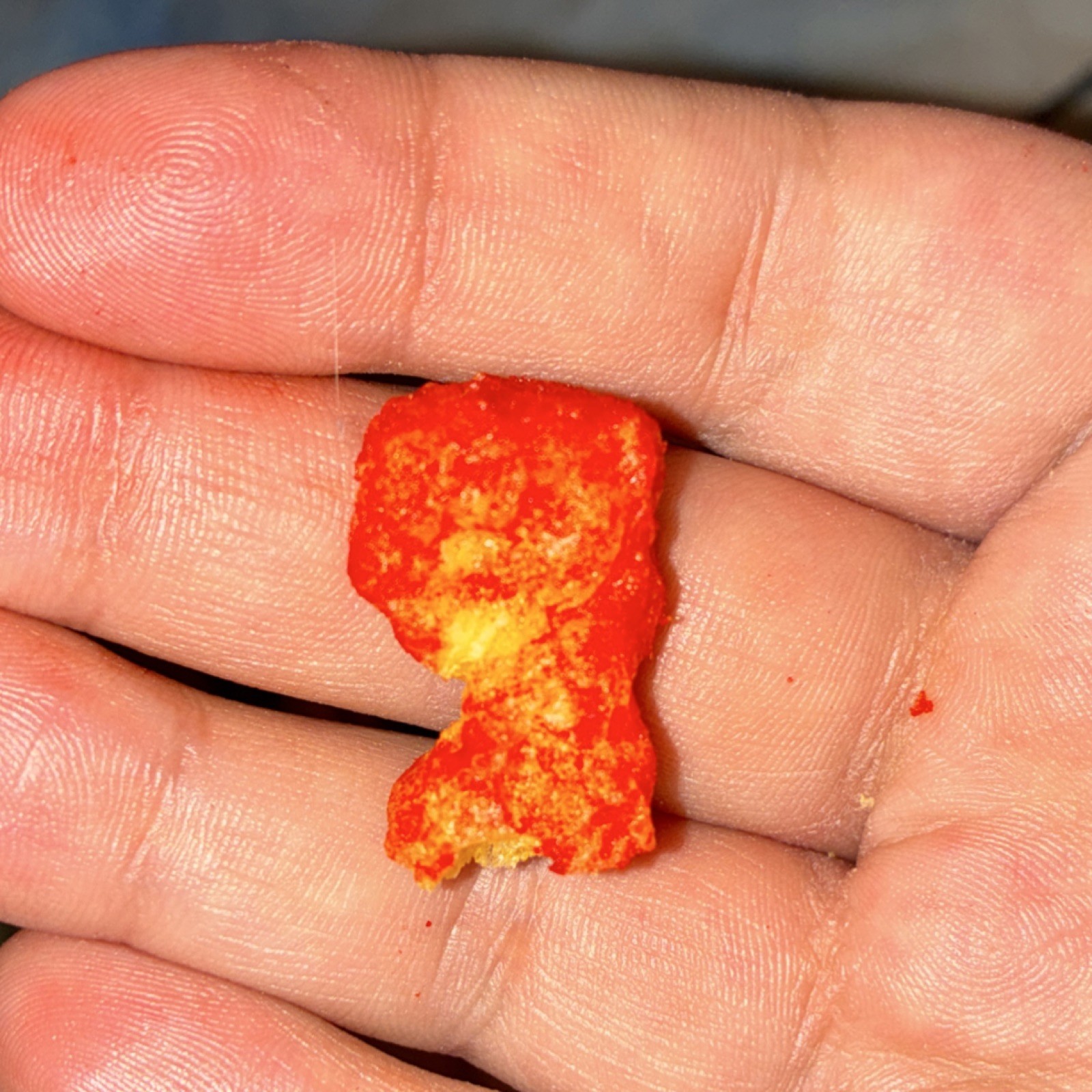 Flamin hot Flavored Puffed Corn Snack that look like infinity gauntlet