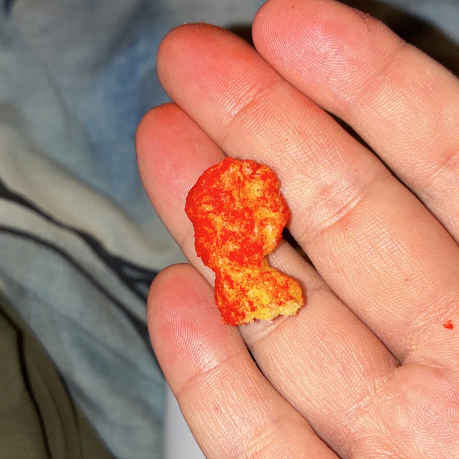 Flamin hot Flavored Puffed Corn Snack that look like infinity gauntlet