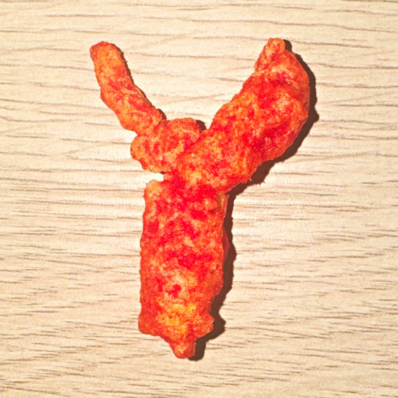 Cheetos Chili Puffed Snack – Single Cheese Puff Piece Irregular Shape