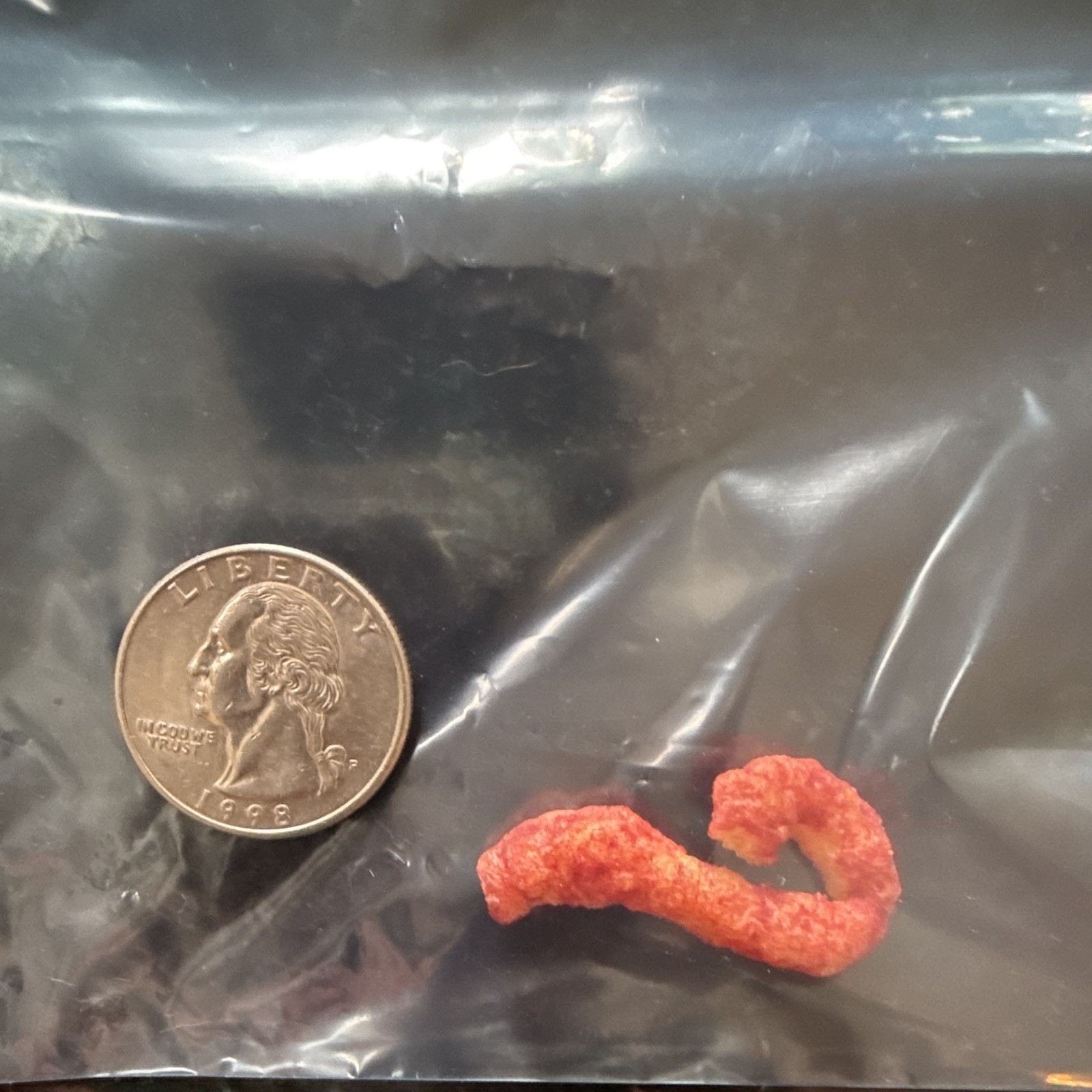 Cheetos Spicy Puffed Snack shaped like Maui fishhook, in Resealable Bag