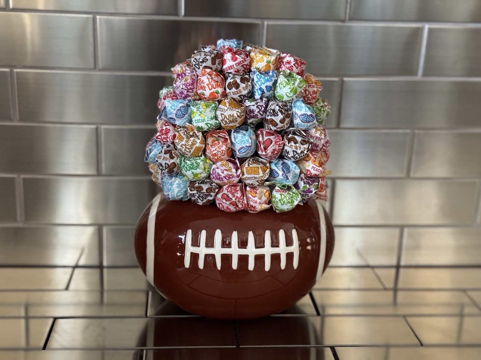 Candy Bouquet/Basket Ceramic Football With Dum Dum Lollipops & White Bow
